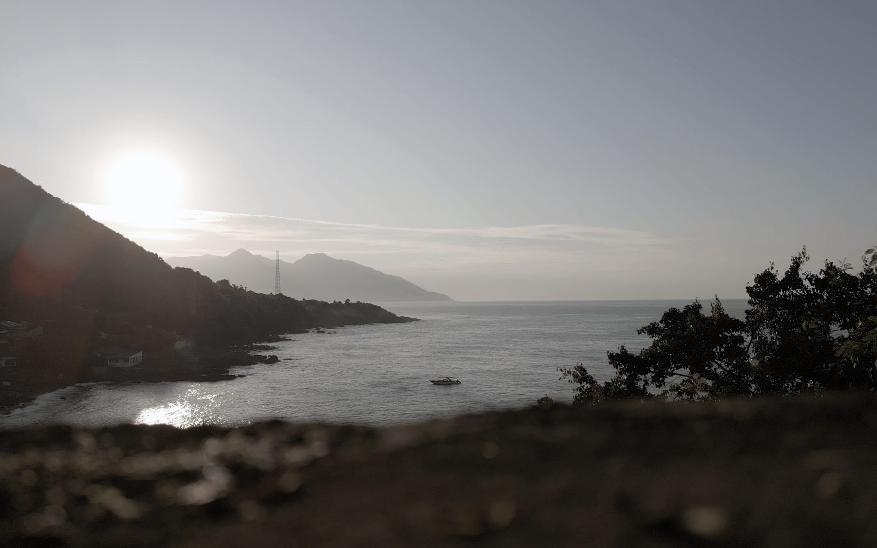 Sunset over the coastline near the fishing village in Indonesia