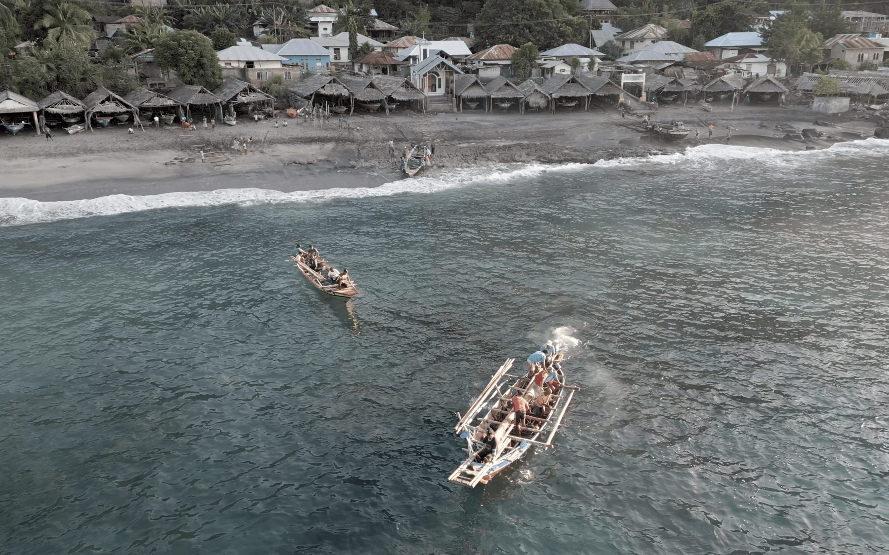 Aerial view of fishing boats near a remote Indonesian village